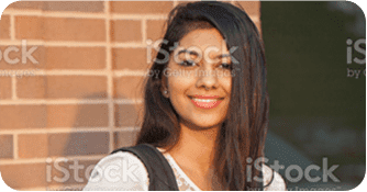 Smiling young woman with long dark hair.