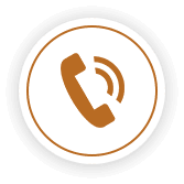 A circular white icon with a gold border, featuring a golden telephone handset symbol.