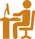 A silhouette of a person sitting at a desk working on a computer, with a lamp and a plant placed on the desk.
