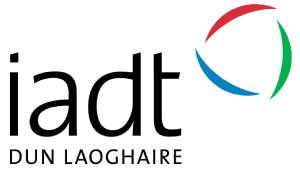 Logo of Dun Laoghaire Institute of Art Design and Technology featuring the acronym "iadt" in black text and a circular, multicolored graphic with red and green arcs.