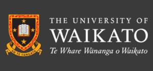 Logo of the University of Waikato, featuring a shield with a book emblem, flanked by Māori carvings, with the name in English and Māori.